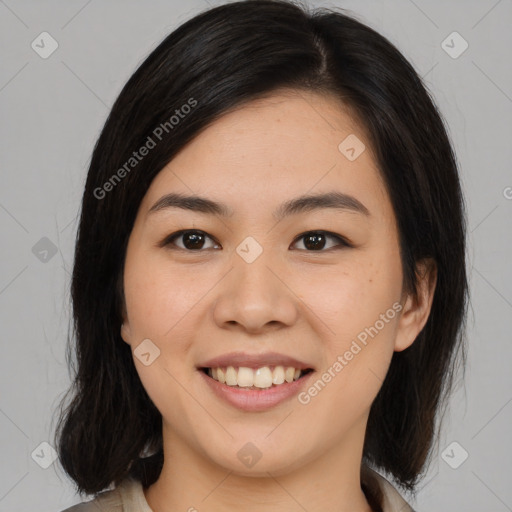 Joyful asian young-adult female with medium  black hair and brown eyes