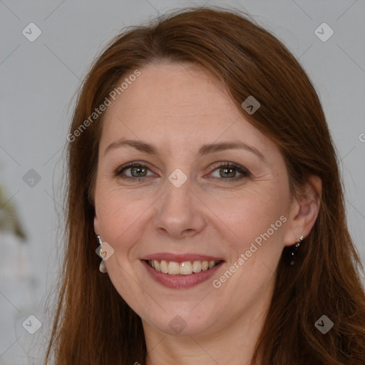 Joyful white adult female with long  brown hair and brown eyes