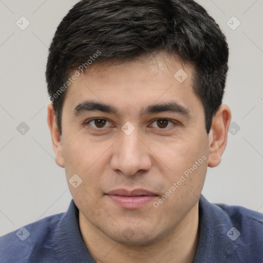 Joyful white young-adult male with short  black hair and brown eyes