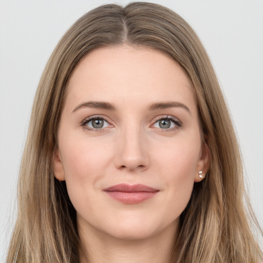 Joyful white young-adult female with long  brown hair and grey eyes