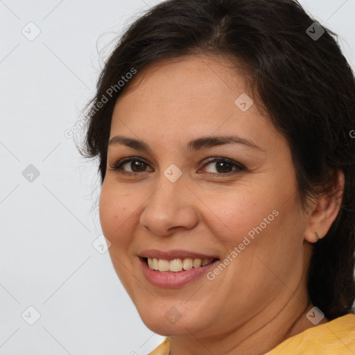 Joyful white adult female with medium  brown hair and brown eyes