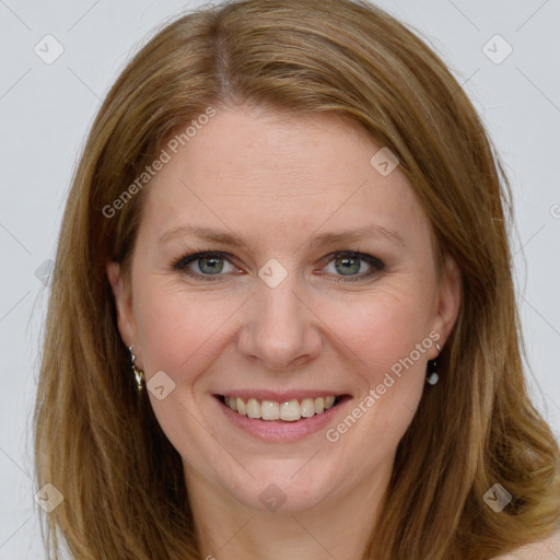 Joyful white young-adult female with long  brown hair and blue eyes