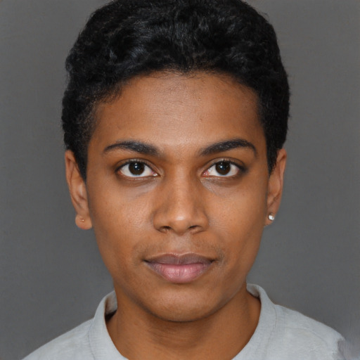 Joyful black young-adult female with short  black hair and brown eyes