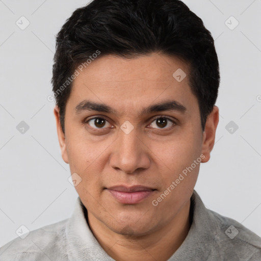 Joyful white young-adult male with short  black hair and brown eyes