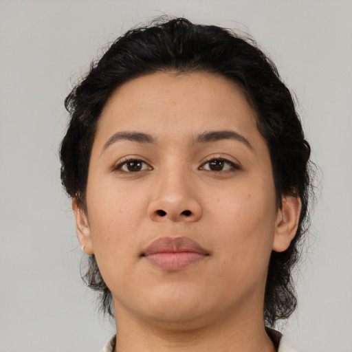 Neutral latino young-adult female with medium  brown hair and brown eyes