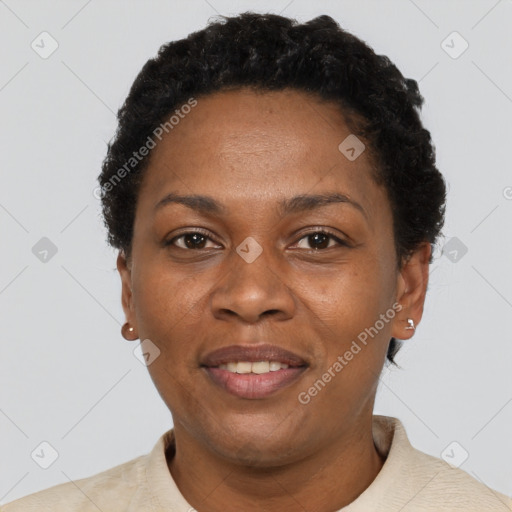 Joyful black adult female with short  brown hair and brown eyes