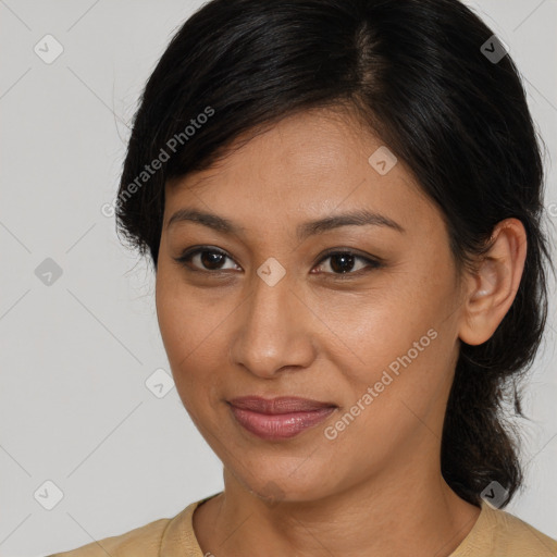 Joyful latino young-adult female with medium  brown hair and brown eyes