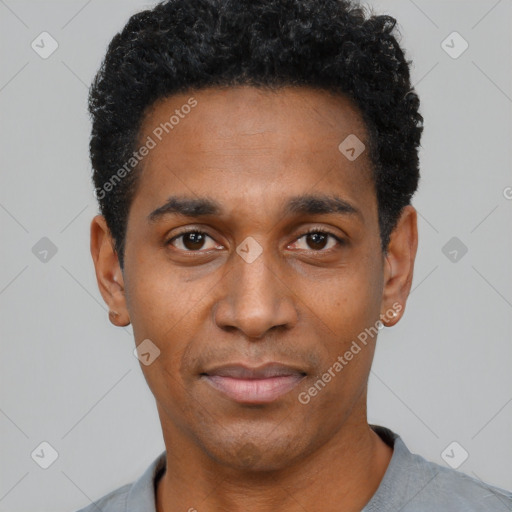 Joyful black young-adult male with short  black hair and brown eyes