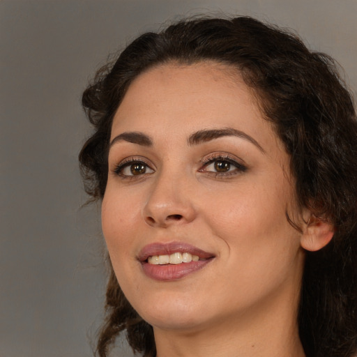 Joyful white young-adult female with medium  brown hair and brown eyes