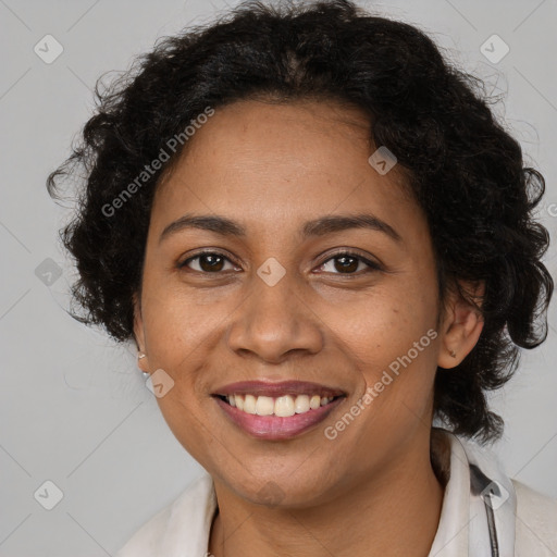 Joyful latino adult female with medium  brown hair and brown eyes