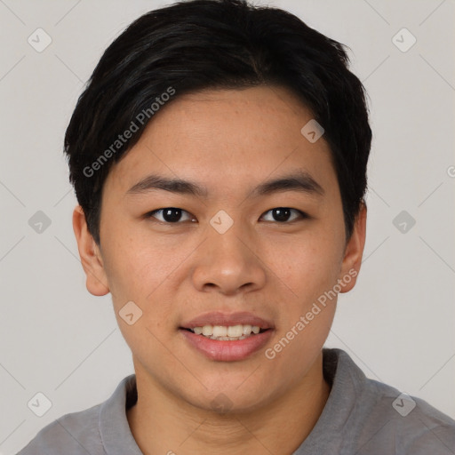 Joyful asian young-adult male with short  black hair and brown eyes