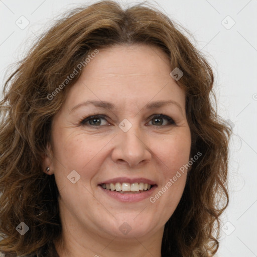 Joyful white adult female with long  brown hair and brown eyes