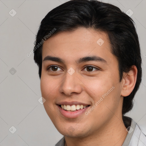 Joyful asian young-adult male with short  brown hair and brown eyes