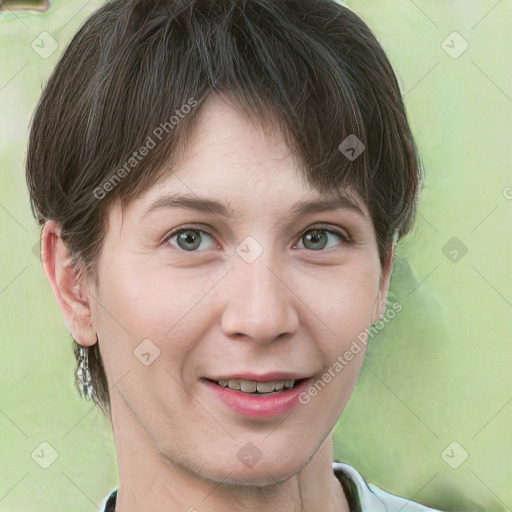 Joyful white young-adult female with short  brown hair and grey eyes