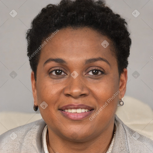 Joyful black young-adult female with short  brown hair and brown eyes