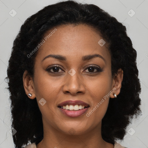 Joyful black young-adult female with medium  brown hair and brown eyes