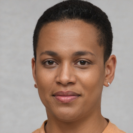 Joyful black young-adult female with short  brown hair and brown eyes