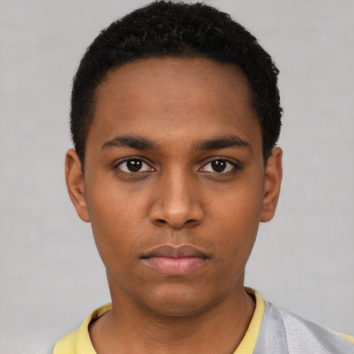 Neutral black young-adult male with short  black hair and brown eyes