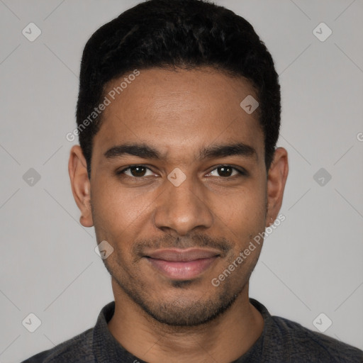 Joyful black young-adult male with short  black hair and brown eyes