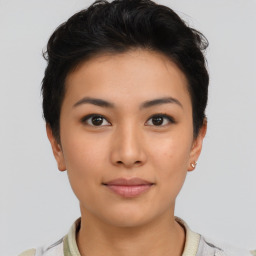 Joyful asian young-adult female with short  brown hair and brown eyes