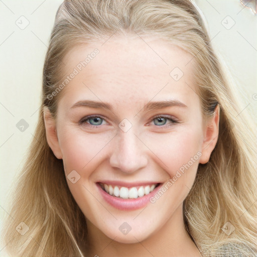 Joyful white young-adult female with long  brown hair and blue eyes