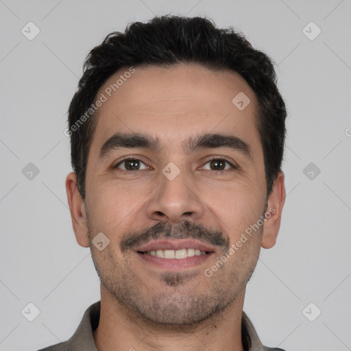 Joyful white young-adult male with short  black hair and brown eyes