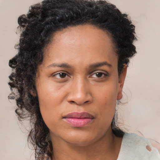 Neutral black young-adult female with short  black hair and brown eyes