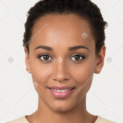 Joyful black young-adult female with short  brown hair and brown eyes