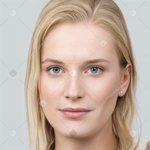 Joyful white young-adult female with long  brown hair and blue eyes