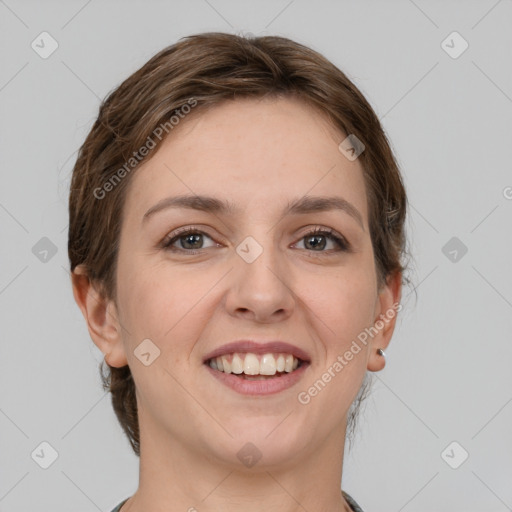 Joyful white young-adult female with short  brown hair and grey eyes