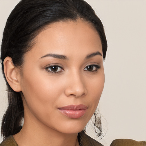 Joyful latino young-adult female with medium  brown hair and brown eyes