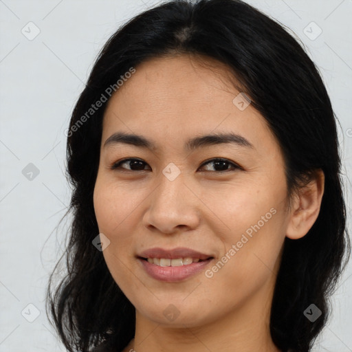 Joyful asian young-adult female with long  brown hair and brown eyes