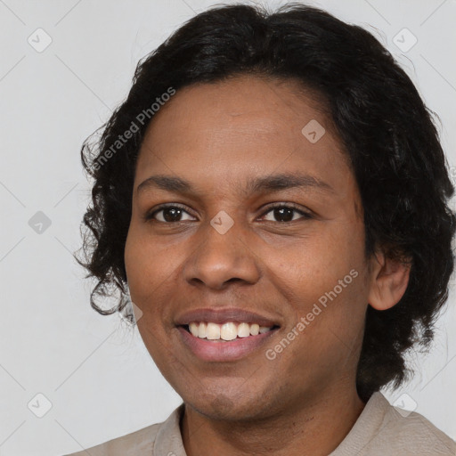 Joyful black young-adult female with medium  brown hair and brown eyes