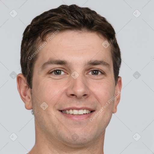 Joyful white adult male with short  brown hair and grey eyes