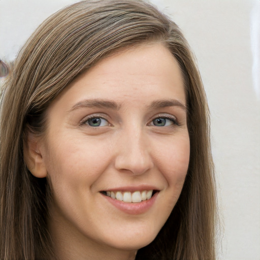 Joyful white young-adult female with long  brown hair and grey eyes