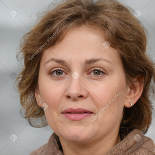 Joyful white adult female with medium  brown hair and blue eyes