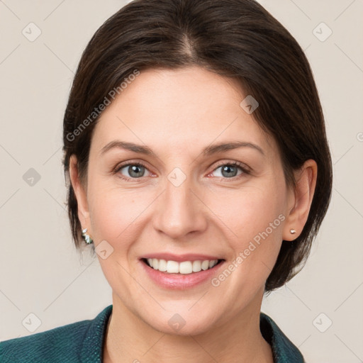 Joyful white young-adult female with medium  brown hair and grey eyes