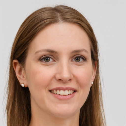 Joyful white young-adult female with long  brown hair and grey eyes