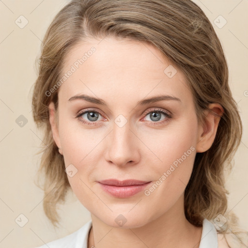 Joyful white young-adult female with medium  brown hair and blue eyes