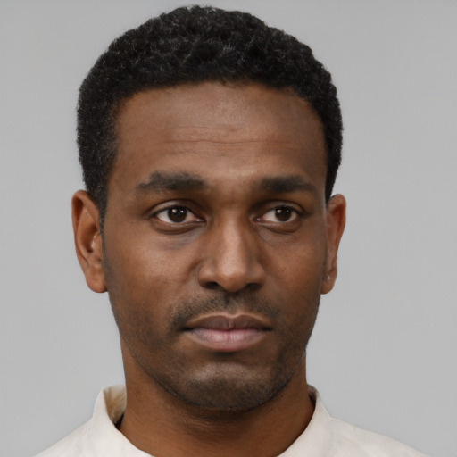 Neutral black young-adult male with short  black hair and brown eyes