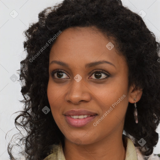 Joyful black young-adult female with long  brown hair and brown eyes