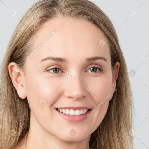 Joyful white young-adult female with long  brown hair and blue eyes