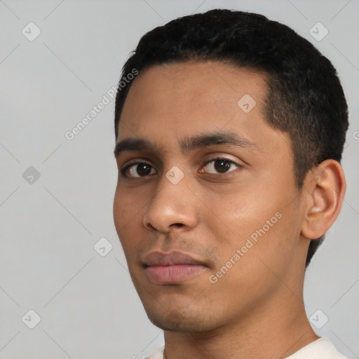 Neutral latino young-adult male with short  black hair and brown eyes