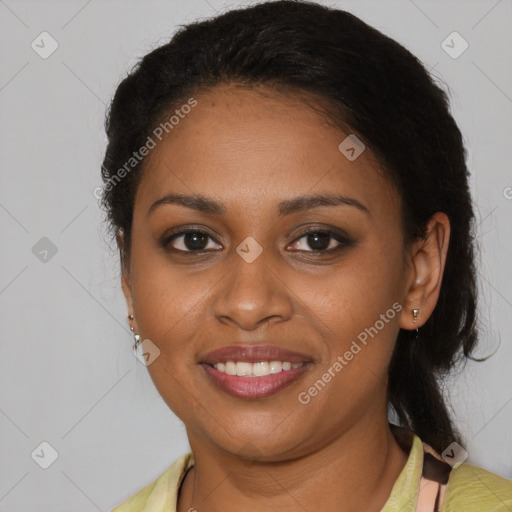 Joyful black young-adult female with long  brown hair and brown eyes