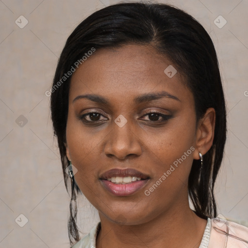 Joyful black young-adult female with medium  black hair and brown eyes