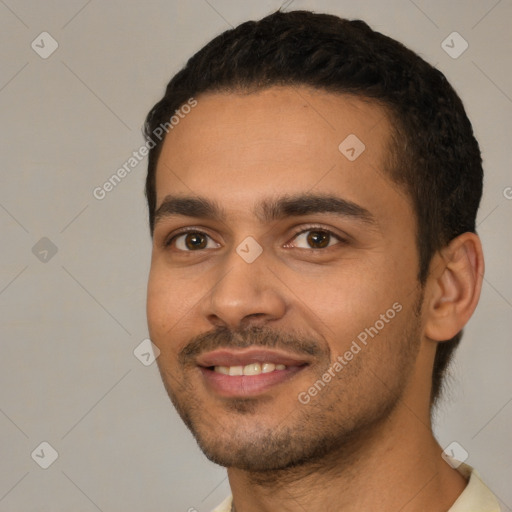 Joyful white young-adult male with short  black hair and brown eyes