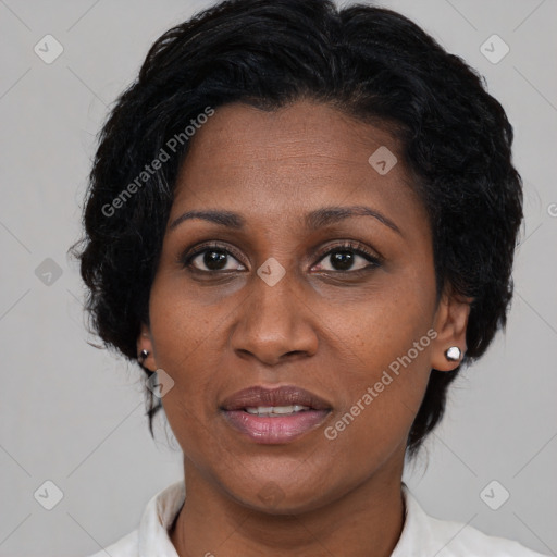 Joyful black adult female with medium  brown hair and brown eyes