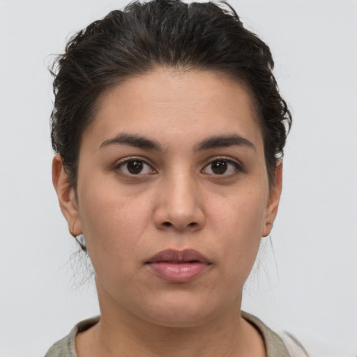 Neutral white young-adult female with short  brown hair and brown eyes