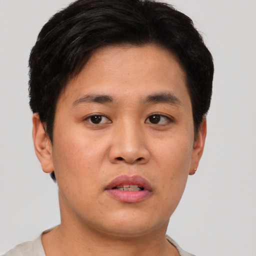 Neutral asian young-adult male with short  brown hair and brown eyes