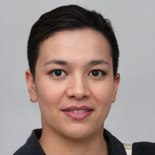 Joyful white young-adult female with short  black hair and brown eyes